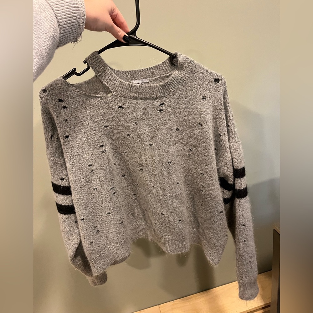 Grey and black striped arms sweater